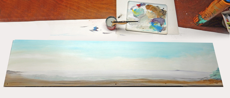 Décor de fond peint représentant un ciel et un paysage avec palette et pinceau