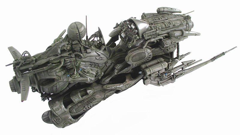 Maquette de motovolante futuriste gris-vert très détaillée vue de trois quarts sur fond blanc