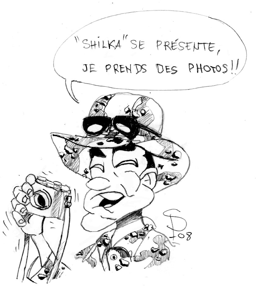Dessin humoristique d'un soldat souriant en tenue camouflage prenant des photos du Shilka