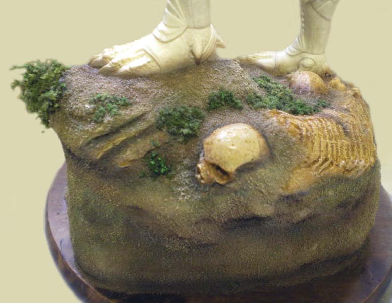 Socle de diorama avec crâne et squelette intégrés au sol, pieds de la figurine Predator