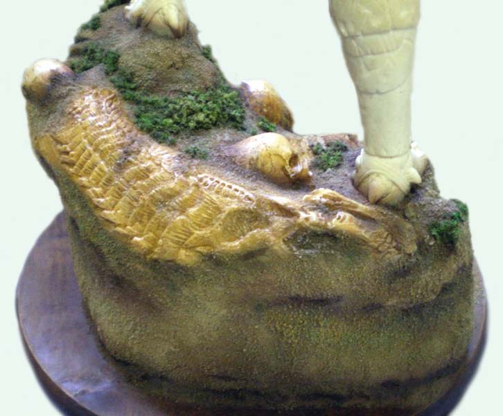 Socle de diorama avec mousse végétale et crâne, pied de figurine Predator posé dessus