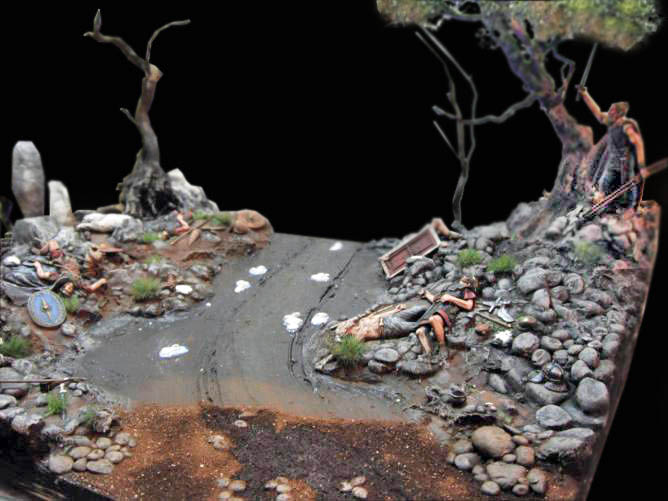 Diorama de scénette avec chemin boueux, arbres morts, rochers et figurines de guerriers romains au combat